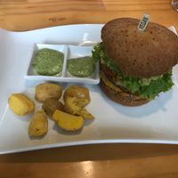 Vegan Burger with papas criollas. at VEGANO El Buen Alimento in Cali