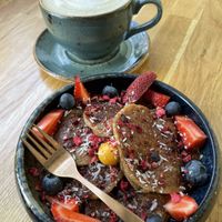 Latte and vegan pancakes  at Trip Cafe in Tallinn