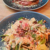 Salad with vegetables and spicy peanut sauce and pancake filled with mushrooms and beetroot pesto. at Trip Cafe in Tallinn