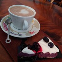 Vegan blueberry cheesecake with hot chocolate (oat milk) at Beans and Tales in Malmo