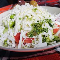 Salad with cucumbers, tomatoes, peppers, onions, olives, and fresh grated cheese (vegans as for no cheese - if they have extra beans, nuts, or seeds they cab sprinkle them on top). at Sunny's in Borovets