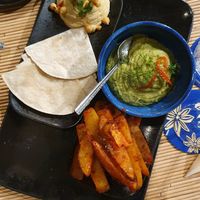 Hummus, broccoli guacamole and spiced potato wedges at Drinks & Co in Paris
