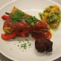 Polenta w olives stuffed with vegetables in a tomato sauce, pumpking and brocoli salad. at Govinda's Restaurant in Septon