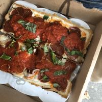 Detroit style pizza with vegan cheese + pepperoni   at Peels On Wheels in Rochester
