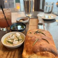 Some delicious type of bread with spreadings  at Coletta in New York City
