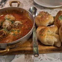 Puttanesca Meatballs with garlic knots. at Coletta in New York City
