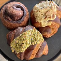 Cinnamon roll, almond croissant and pistachio croissant   at Veg'n'lishious in Leeds