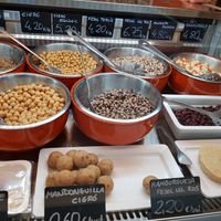 Prepared legumes and patties at Llegums Cuits Isar in Girona