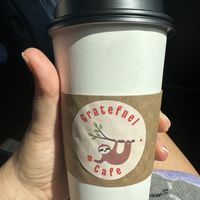 Cute logo.   This was a mushroom coffee with oat milk.. a little sweet for me but still good   at Gratefuel Cafe in Fort Lauderdale
