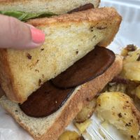 Two slices of meat on club sandwich, they forgot the cheese and the vegan sriracha mayo   at Butter Cafe in Dayton