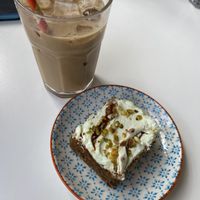 Carrot and pistachio cake, iced latte with oat milk   at Vera Artisan Bakery in Stirling