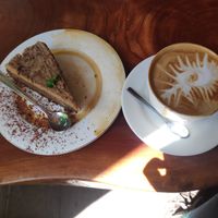 Carrot cake and cappuccino with coconut milk at WAIRA Ice Cream & Speciality Coffee in Minca