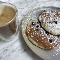 Vegan pancake and cafe latte  at Evviva - Yonge St in Toronto
