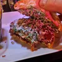 inside of the burger; smothered with sauce  at Klandestine in Basel