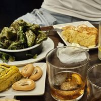 Pimientos del padrón y tortillas de patatas y de calabacines (las patatas bravas se acabaron pronto y no tengo fotos jajaja) at La Tranca in Malaga