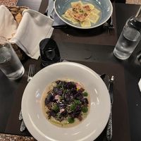 Crema di cannellini, semi di canapa, olio alla menta, quinoa, gel di bieta e polvere di cappero / Raviolo con la barbabietola, perle di tapioca e riduzione di agrumi  at Caffè Tomaso in Udine