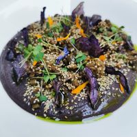 Crema di fagioli neri, chips di patata viola, melanzane at Caffè Tomaso in Udine