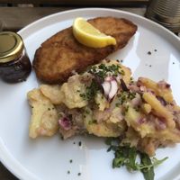 Schnitzel mit Erdäpfelsalat  at Tisch in Vienna