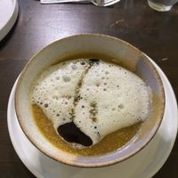 2: pumpkin cream soup with seed oil foam  at Tisch in Vienna
