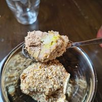 Mozart Eisknödel
Hazelnut-chocolate ice cream balls filled with marzipan, pistachio cream covered in caramelised hazelnut crumbs. at Tisch in Vienna