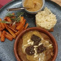 Main dish risotto with champagne, glazed carrots, cream of beans with melted vegan "cheese" at Vroom in Geneva