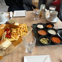 Vegan charcuterie board: wraps with veg & seitan, falafel, kale crackers, fried peppers & mushrooms, raw peppers & carrots. You can choose from several vegan sauces and dips. at Food Garden in Zagreb
