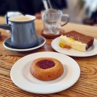 Peanut butter jammy dodger, spiced apple and carrot cake, and oat milk chai latte. at Feed General Store in Stockport