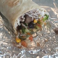 The vegan burrito with white rice, black beans, corn, nushrooms, salad, cucumber, tomatoes, onion 😋🤤 at Burrito Madre in Belgrade