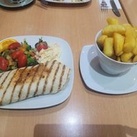 Sauted Mushroom, Chefs Falafel, and Walnut Wrap with a Side of Chips at Two the Square in Conwy