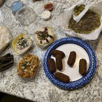 Dolmas, batata hara, baba ganoush, hummus, falafel, za’atar manaqish  at Jafra Mediterranean Restaurant in St Charles