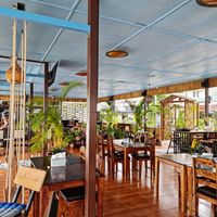 Bright open space, tables plus beanbags to sit. at The Shell Lounge in Koh Phangan