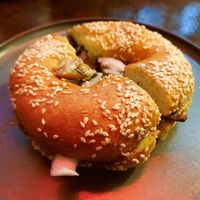 Fresh bagel with cream cheese and warm mushrooms at Coffee Place in Tbilisi
