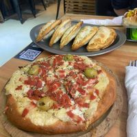 Pizza y empanadas at Vegan Palermo in Buenos Aires