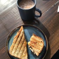 mushroom and vegan cheese toastie, hot chocolate with plant milk  at La Colona in Puerto Natales