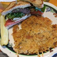 Jonathan Richman with hash browns at Modern Times Cafe in Minneapolis