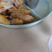 Greasy, tasteless vegetarian food. Dirty tables and--even though the restaurant was empty--the waitress would not let us sit at a table but made my toddler sit at a dirty bar.  at Yellow Bark in La Fortuna