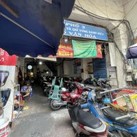 Go into this parking lot then up the stairs on the left   at Chay Saigon Bistro in Ho Chi Minh City