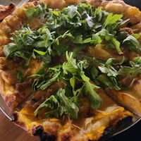 Arugula, potatoes, caramelized onions, butternut squash sauce. at Cushnoc Brewing Co in Augusta