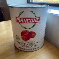 6lb can of tomatoes on every table  at Cushnoc Brewing Co in Augusta
