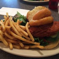 Chicken sandwich with onion rings and fries. at Veggie Galaxy in Cambridge
