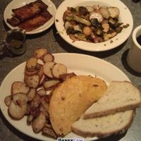 bottom: tofu omlette, breakfast potatoes, and toast; top: seitan chorizo and vegetable potato hash, side of tempeh bacon at Veggie Galaxy in Cambridge