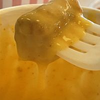 Tot dipped in cheese   at Neat Burger - Bishopsgate in London