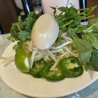 Accompaniments of spicy noodle soup  at Kim Phuong Vegetarian Delight in Renton