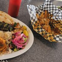 Salmon plate, curry fries, and shy steak plate. at BeeWali's Vegan AF in Los Angeles