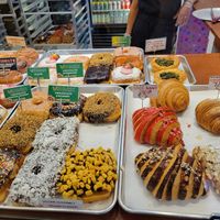 Vegan Donuts selection, Vegan Spinach quiche, Vegan plain croissant. at Pink Love Donuts and More in Miami Beach