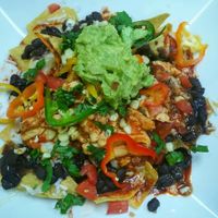 The star of the show, in my opinion: Vegan nachos with vegan "chicken." It's a tasty, beautiful disaster! at Olga's Naturally in Los Angeles