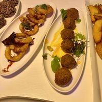 Breaded mushrooms, onion rings, falafel, & brava potatoes.   at Karavan in San Pedro De Atacama