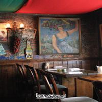 Inside. Pretty dark but great atmosphere. The walls are filled with peoples notes, names, year ect. Such a fun vibe.  at El Pancho in Osaka