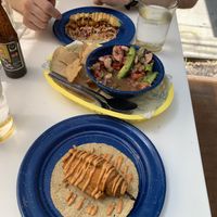 Aguachiles in the middle with fried stuffed jalapeños taco on the bottom  at La PlantisquerÍa in Mexico City