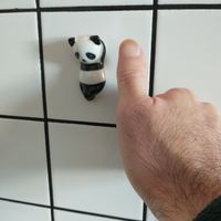 Tiny pandas adorn the wall. at Panda Cantina - Príncipe Real in Lisbon